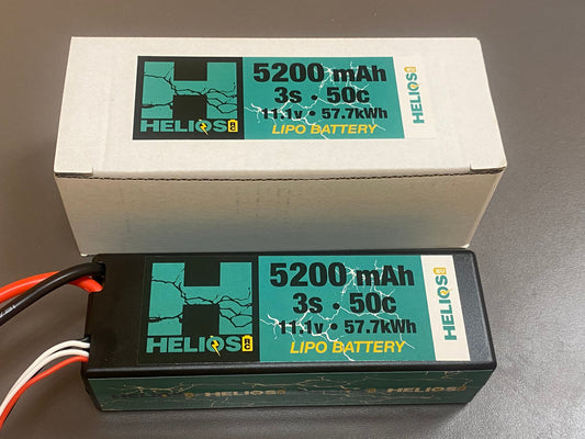 a 5200 mAh 3s 50c 11.1v 57.7 kWh lipo batter in front of its packaging 