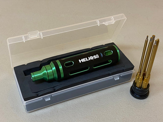 A green and black Helios RC All-in-One Tool with five gold-colored hex tips, displayed inside a clear plastic case.
